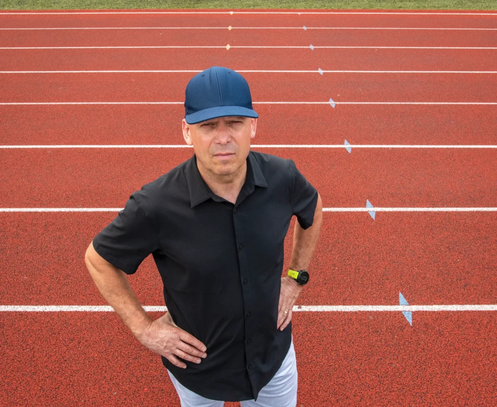Coach Rick Muhr working with runners