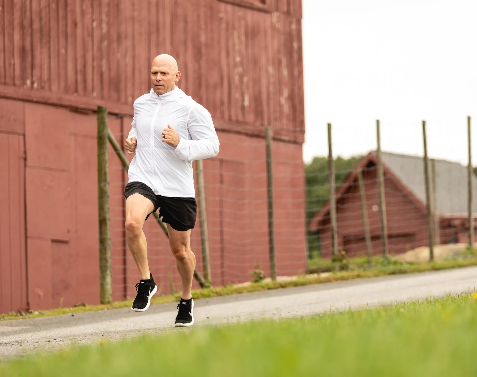 Coach Rick Muhr running on a country road
